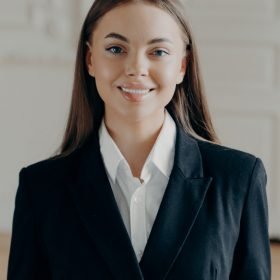 young-smiling-bussiness-woman-looking-at-camera-an-2021-09-02-23-47-32-utc.jpg